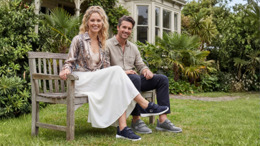 A woman and a man are sitting.