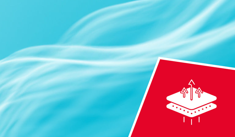 Bright blue sky with wispy white clouds. A red icon shows a moisture-wicking diagram with arrows and water droplets, indicating breathable fabric technology.
